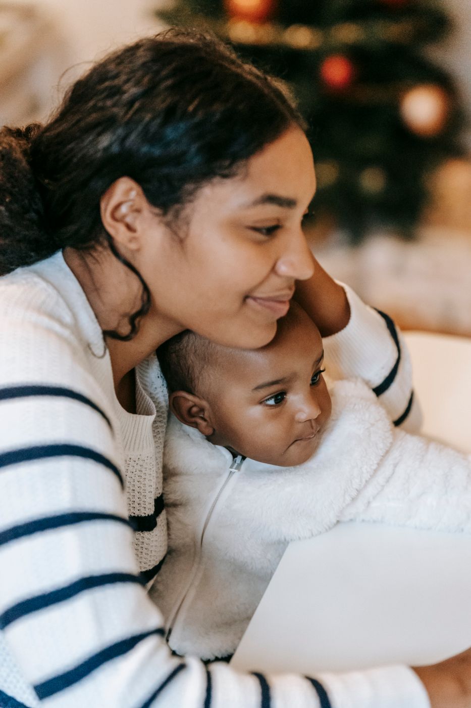 Woman sitting with a baby on her lap